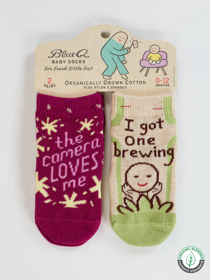 The Camera Loves Me/ I Got One Brewing Baby Socks